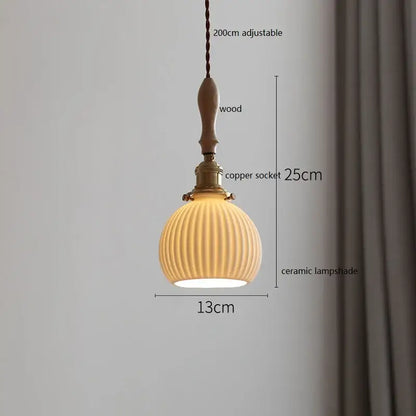 Scalloped white ceramic led pendant light with vertical ridges suspended by wooden handle and copper socket decorbites ceramic led