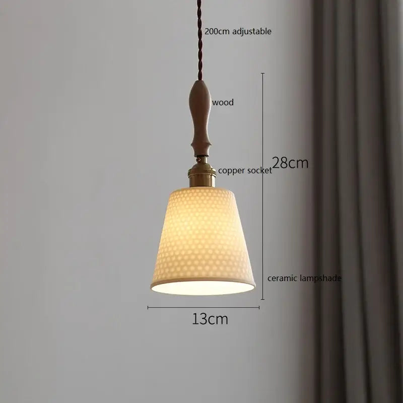 Scalloped white ceramic led pendant light with textured honeycomb pattern hanging from wood and copper socket