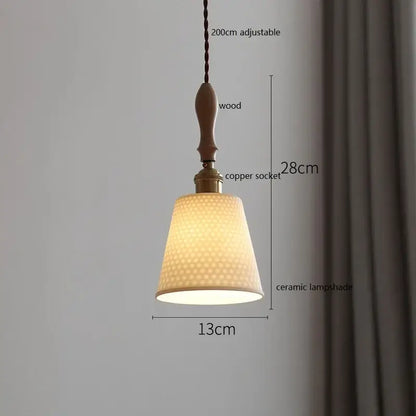 A warm-toned scalloped white ceramic led pendant light with honeycomb texture hanging from wooden handle for dining room decorbites ceramic led pendant