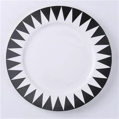 White ceramic dessert plates with bold black triangular geometric pattern around rim from decorbites ceramic dessert collection