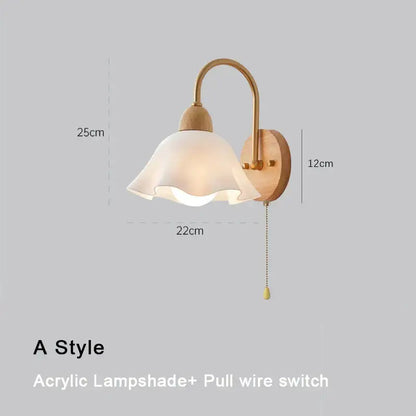 A warm-toned Scandinavian brass and cream led wooden wall lamp with curved arm and acrylic shade for bedroom decorbites cream led
