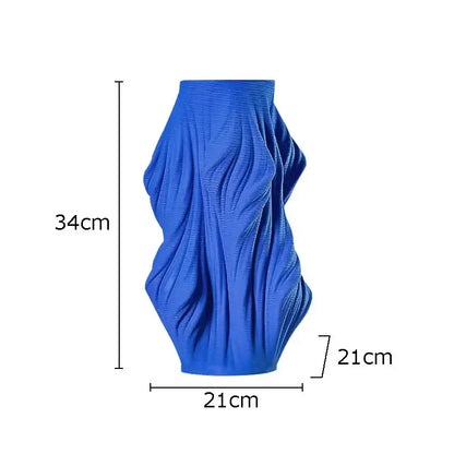 Vibrant blue decorbites ceramic vase with textured sculpted surface resembling flowing fabric for bedroom decor