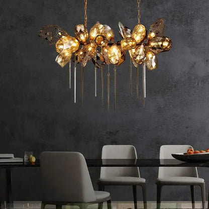 Sculptural gold glass shades pendant light featuring faceted glass orbs and metallic rods for dining room chandelier