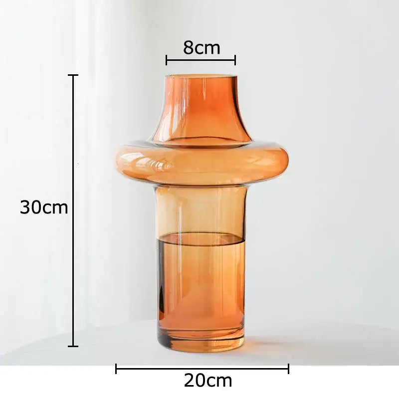 A sleek amber glass vase with a modern tiered design and flared top for living room decorbites amber glass decor