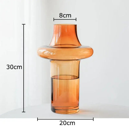A sleek amber glass vase with a modern tiered design and flared top for living room decorbites amber glass decor