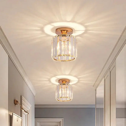Gold-toned crystal mini ceiling light with vertical faceted glass rods and circular brass base for decorbites ceiling lights