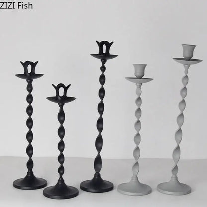 Set of five elegant twisted metal candlestick holders in black and gray featuring ornate tops for decorbites golden candlestick decor