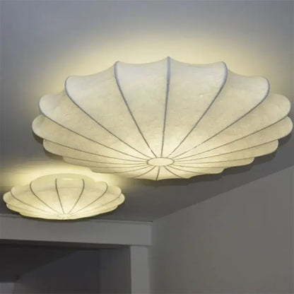 Cream flower pendant light in cream with shell shape, soft glow, and subtle gray veining for dining room decorbites