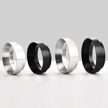 Two pairs of sleek metallic espresso coffee filter adapter rings in polished silver and matte black finishes