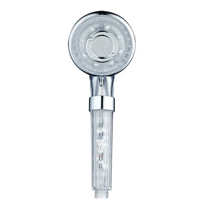 Silver and clear chrome finished high pressure shower head with circular nozzles and visible internal filter chamber