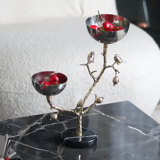 Silver-toned metal snack bowl fruit stand shaped like a tree with two bowls and gold bird figurines for dining room use