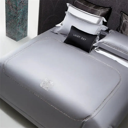 Silver cotton satin jacquard bedding set with subtle embroidered floral design and delicate beaded trim by decorbites