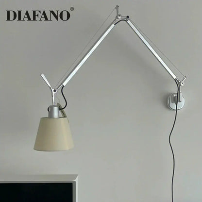 Silver and cream wall lamp with long swing arm and cream fabric shade for adjustable bedroom reading light decorbites
