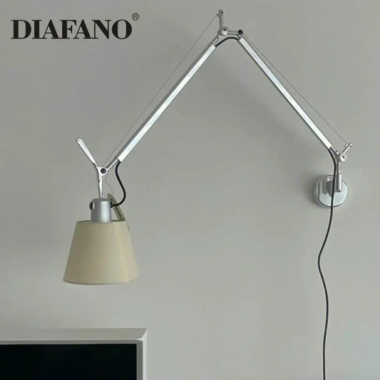 Silver and cream wall lamp with long swing arm and cream fabric shade for adjustable bedroom reading light decorbites