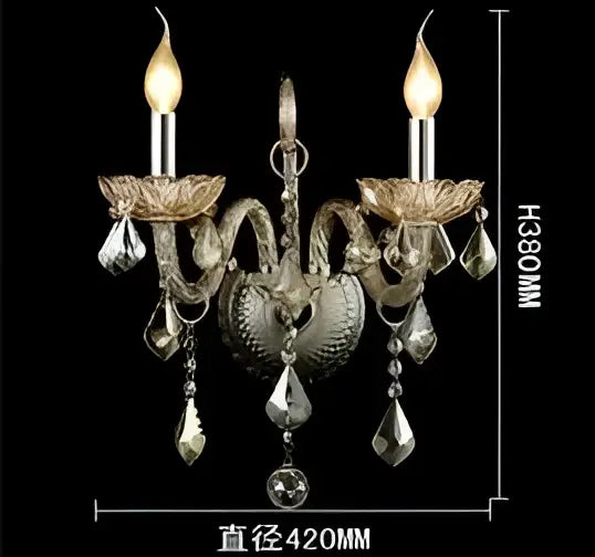 Silver-toned decorbites crystal cognac wall lamp with ornate heart-shaped design and dangling crystal droplets for luxury decor