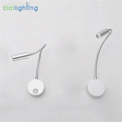 Two silver flexible gooseneck led wall sconces with circular bases for bedroom reading by decorbites 3w flexible