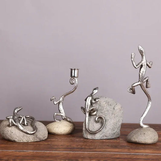 Silver gecko lizard resin candlestick figurines in unique poses on textured stone bases for living room decor by decorbites