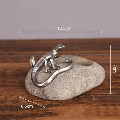 Silver gecko lizard resin candlestick with textured gray stone base and circular opening for living room decorbites decor