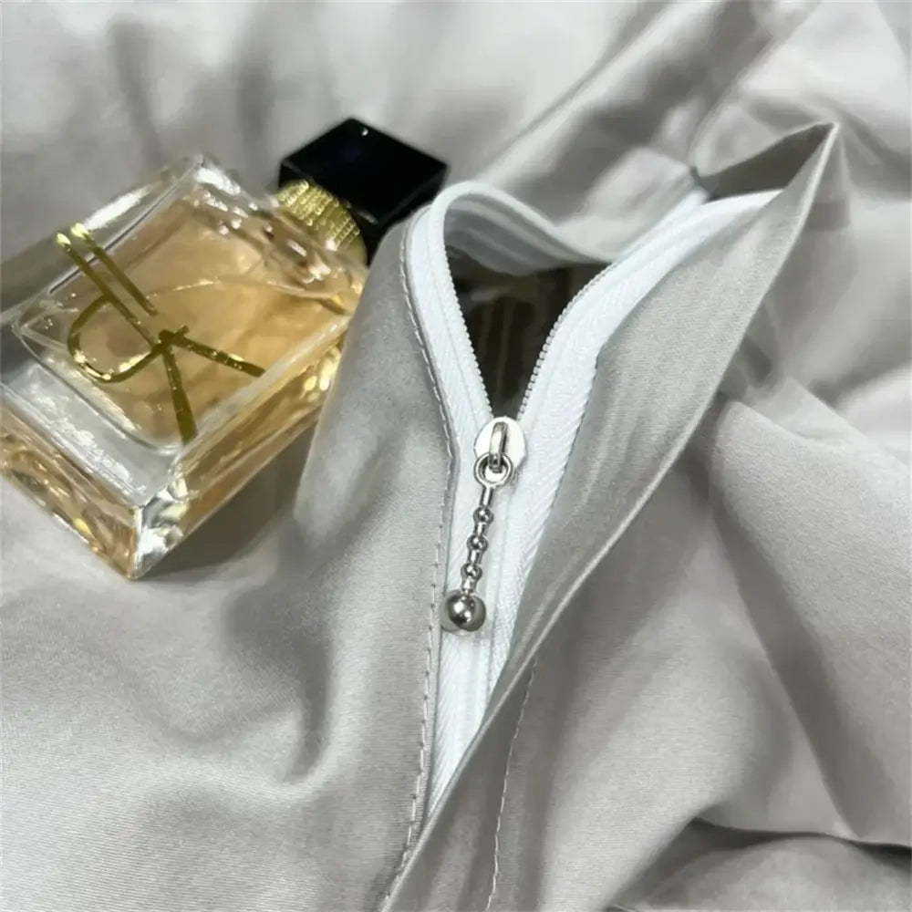 Light gray satin jacket with white zipper and silver pull tab complements silver gray 1200tc embroidery egyptian cotton bedding set by decorbites