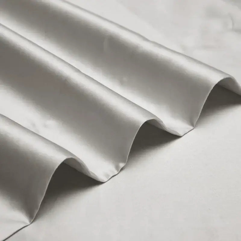 Silver satin egyptian cotton bedding set with subtle sheen and gentle folds from decorbites 1000tc egyptian collection