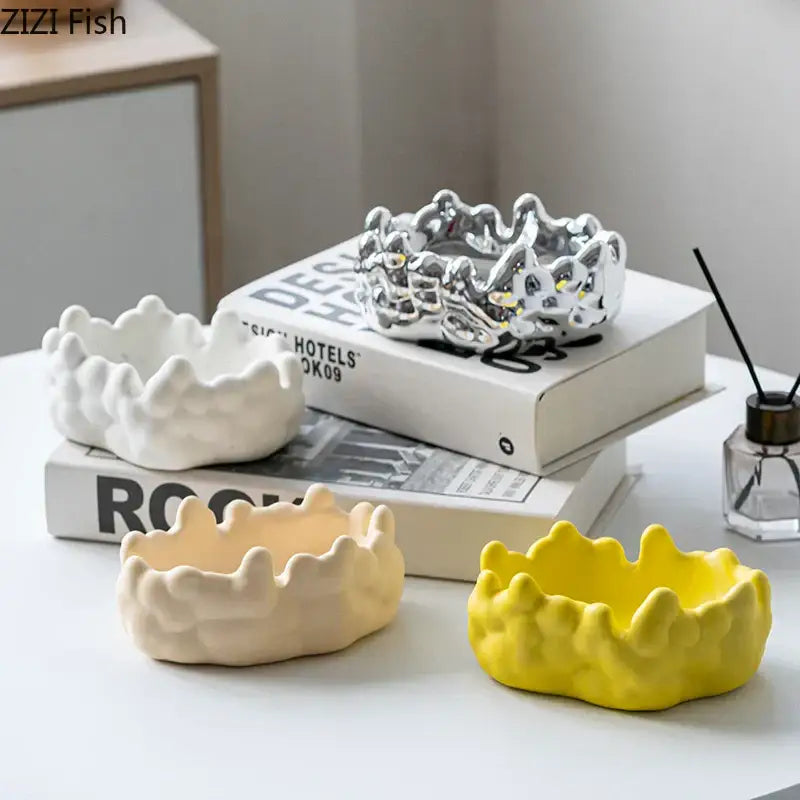 Set of four ceramic bubble clouds crown-shaped decorative bowls in white, cream, yellow, and metallic silver decorbites ceramic bubble