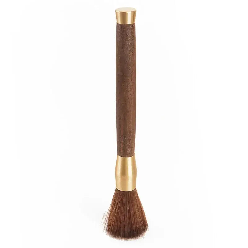 Silver textured espresso brush with sleek brown wooden handle and dense dark bristles for coffee grinder cleaning