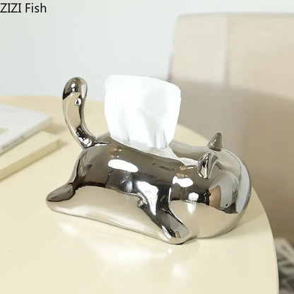 Silver and yellow decorbites cat ceramic tissue box holder with shiny finish and white tissue emerging from back