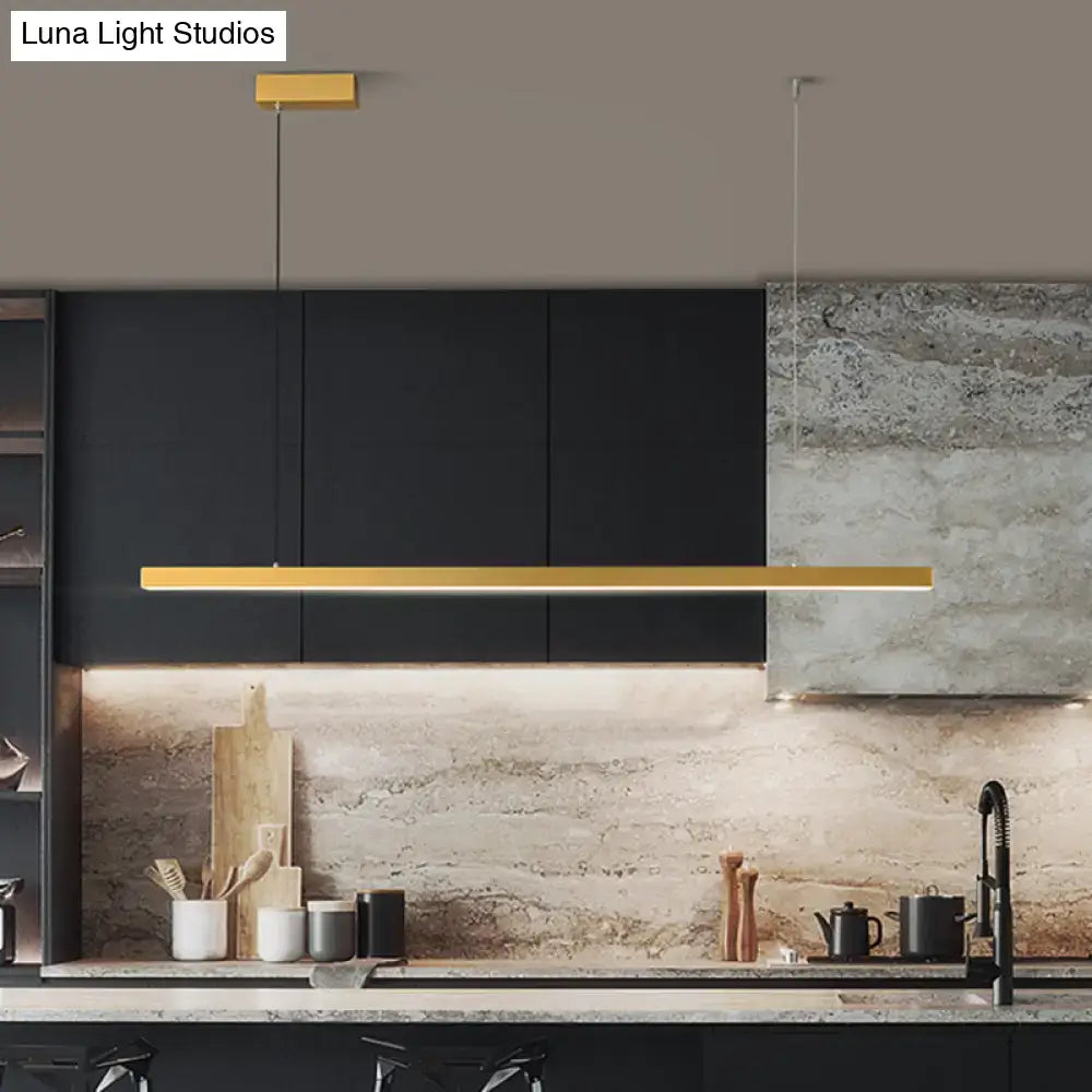 Gold-colored metal simplicity led pendant light with bulb included hanging above dining room kitchen counter