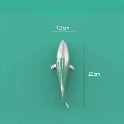 Silver metallic dolphin figurine with sleek reflective surface and detailed fins complementing decorbites goldfish resin wall hanging decor