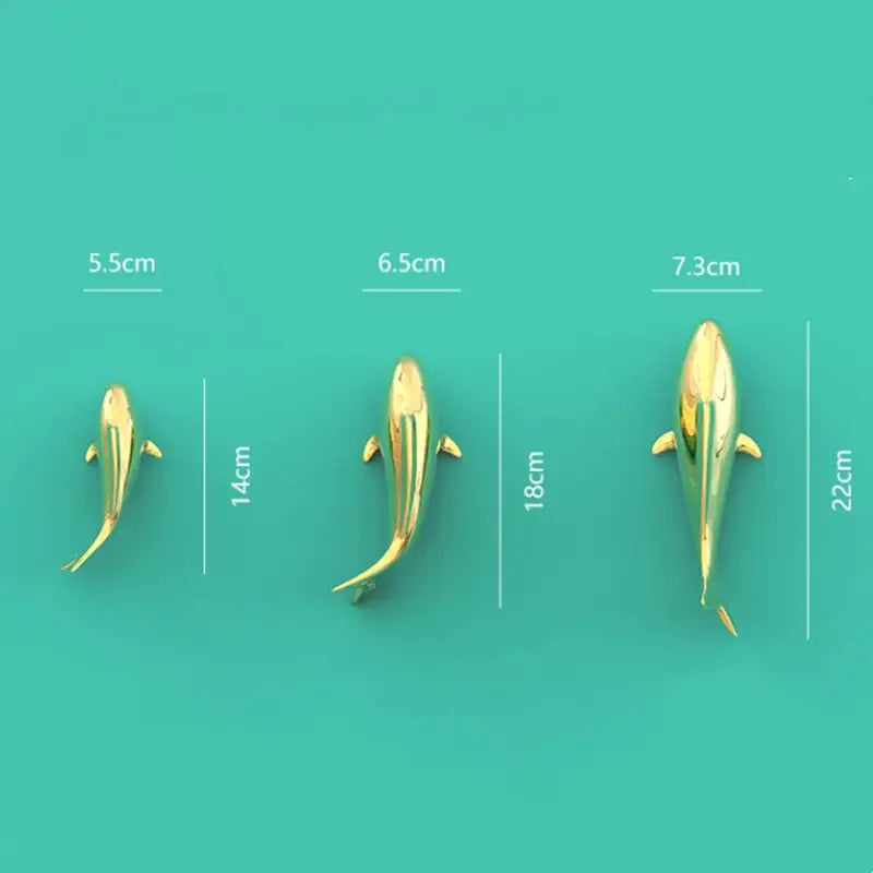 Three sleek metallic golden shark wall hanging decor pieces in varying sizes for decorbites goldfish resin wall display