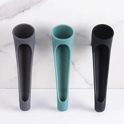 Three sleek modern silicone water tank deflector utensil holders in matte gray teal and black for kitchen use