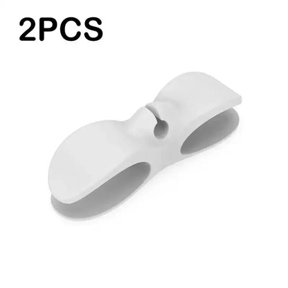 White silicone decorbites cord winder cable organizer with rounded design and central hole for kitchen cable management