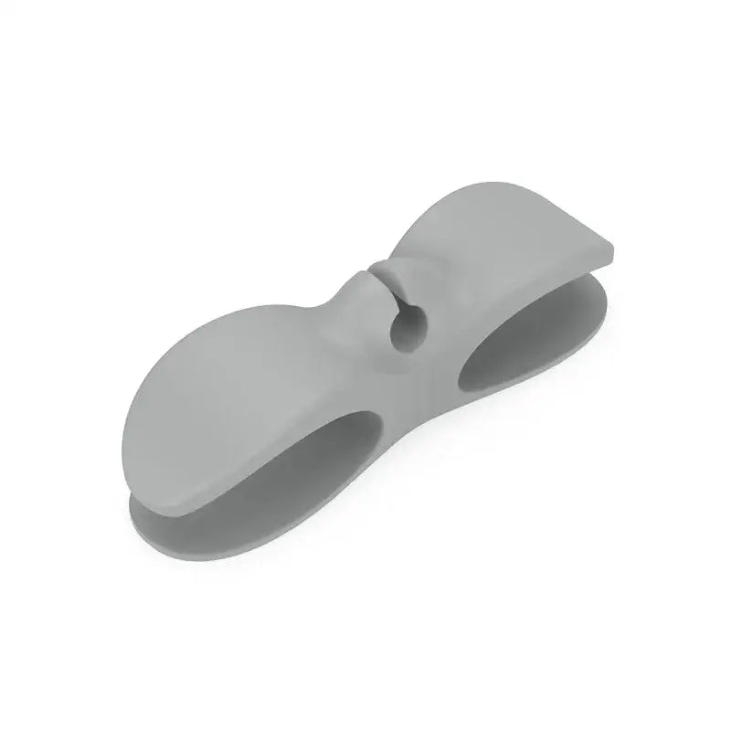 Gray silicone decorbites cord winder with smooth flexible design and two rounded openings for cable organizer use