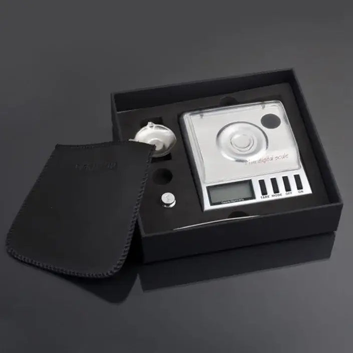 Sleek silver digital milligram gram scale decorbites with a rectangular design and clear display for precision weighing