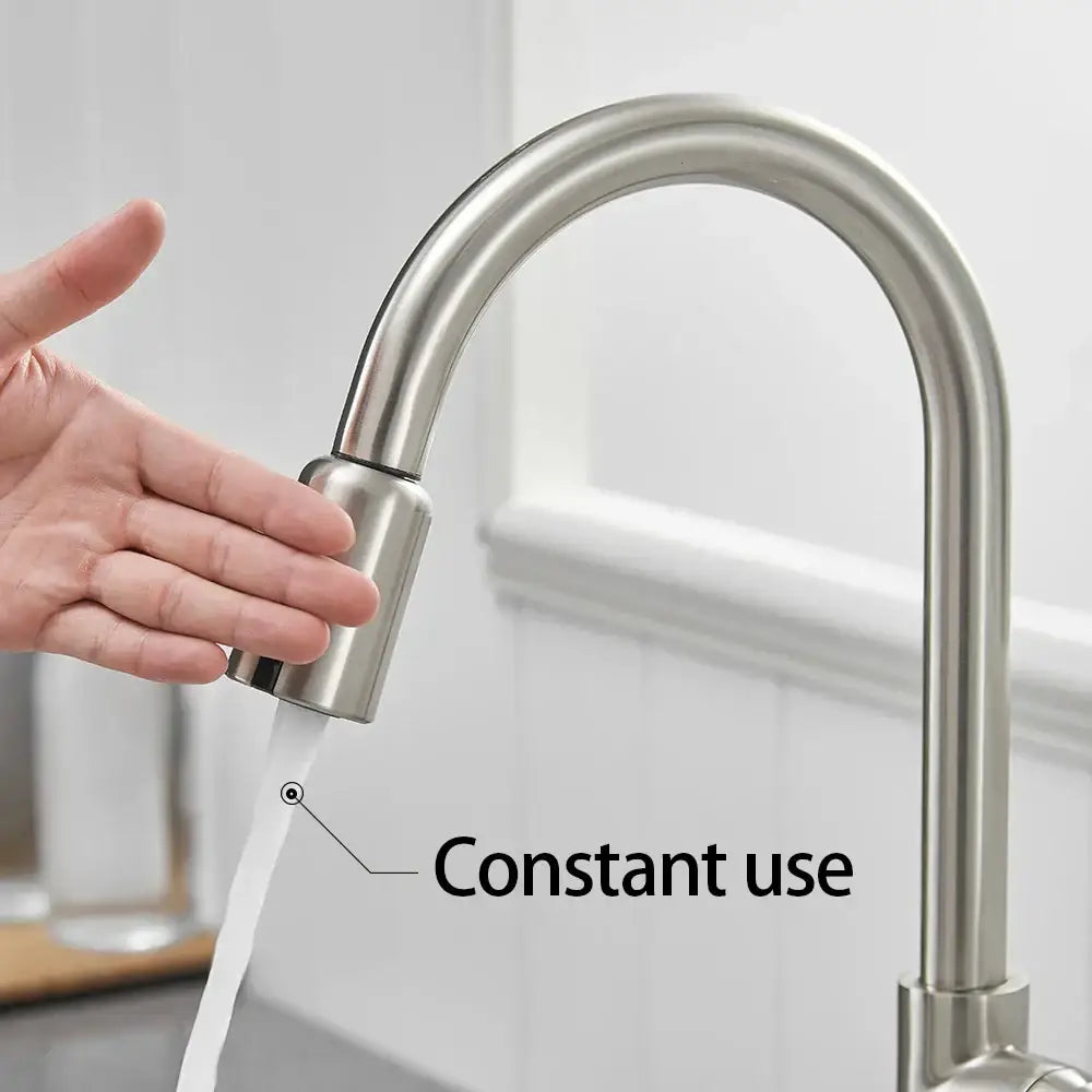 Sleek silver stainless steel kitchen faucet with curved spout and pull-down spray head with usb charging adapter