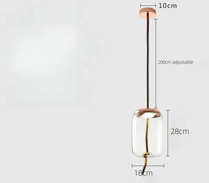 A sleek smoked glass led chandelier with a clear glass globe rose gold accents and adjustable black cord pendant light