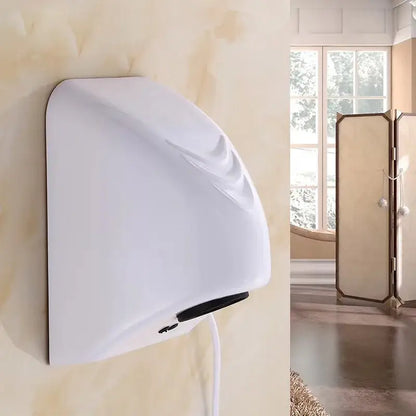 Sleek white and black automatic hand dryer with curved design and black base wall-mounted for bathroom use