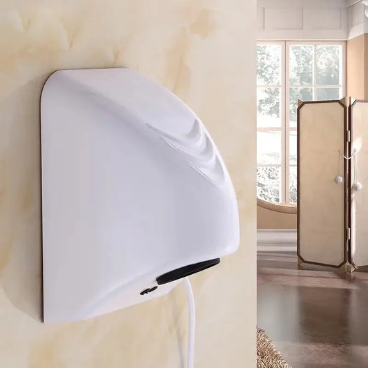 Sleek white and black automatic hand dryer with curved design and black accents mounted on bathroom wall
