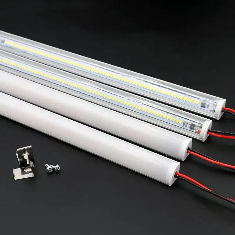 Slim white v type led corner strip lights with clear acrylic diffuser covers and exposed yellowish leds for kitchen cabinets
