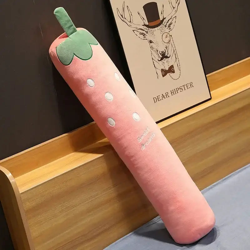 Pink strawberry-shaped plush pillow with green top and white dots paired with decorbites cylindrical long pillow for decor