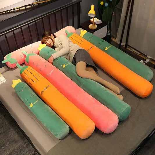 A vibrant orange and green decorbites cylindrical long pillow shaped like a smiling carrot for bedroom decor
