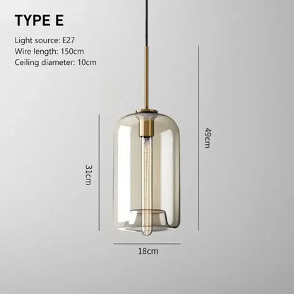 Smoked glass and brass pendant light with cylindrical shade ideal as a modern glass pendant for dining room lighting