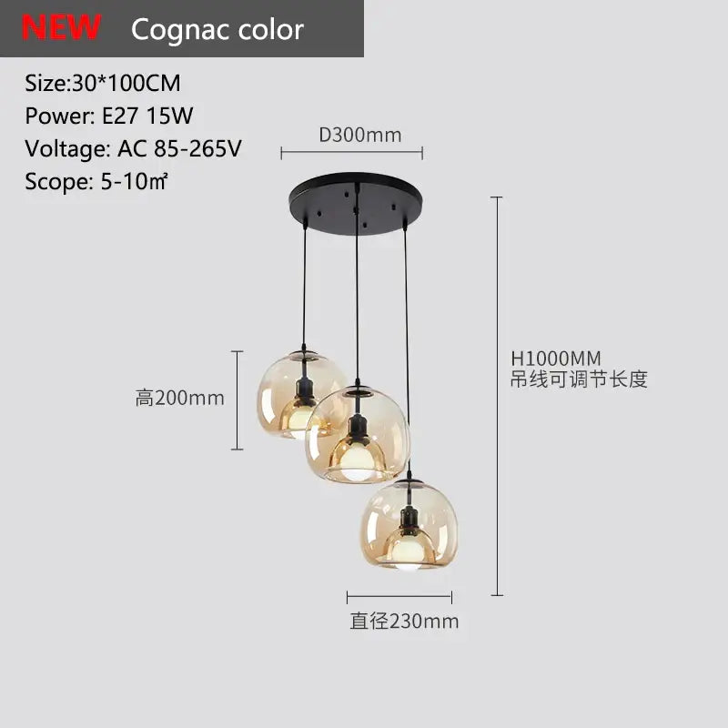 Cognac-colored glass pendant lights with three spherical shades and black ceiling mount for dining table lighting