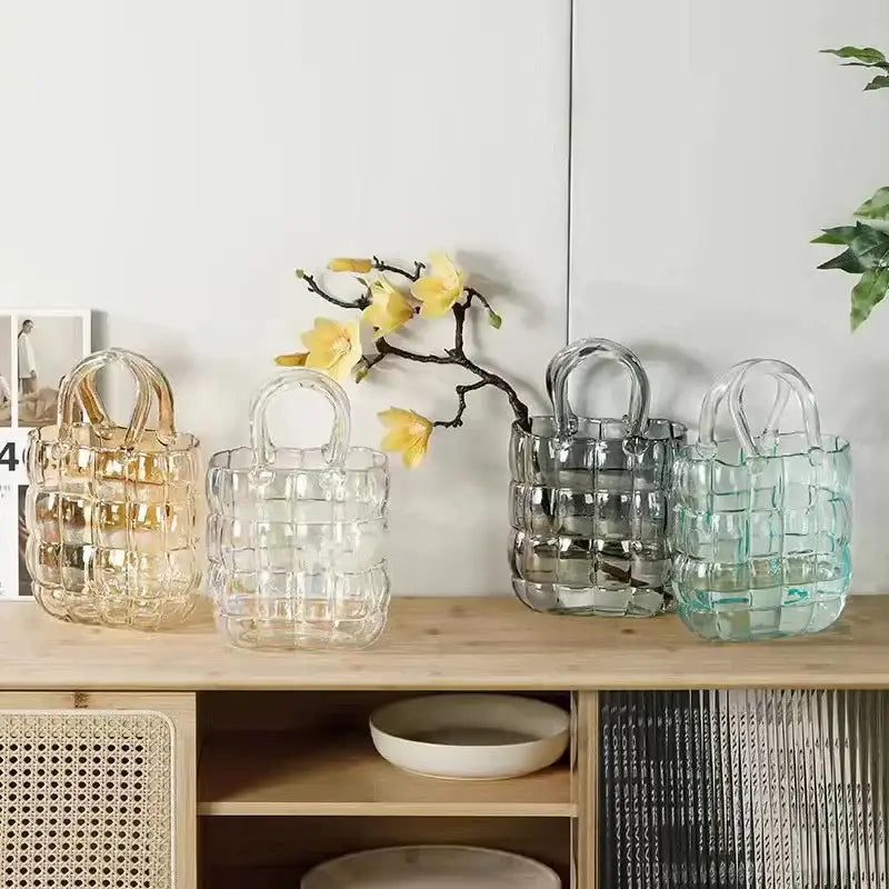 Four transparent glass tote bags in amber clear, smoky gray, light blue, and clear hues for decorbites clear glass decor