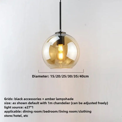 A modern smoky gray pendant light with five amber glass globes and black iron finish hardware as a dining room light source