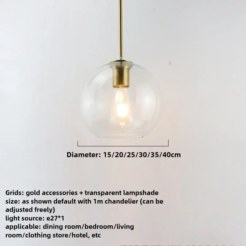 Smoky gray five light pendant light with clear glass globe and gold-toned metal accents in iron finish light source