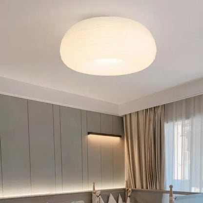 Soft cream apple paper pendant light with a frosted white smooth dome design by decorbites cream for bedroom decor