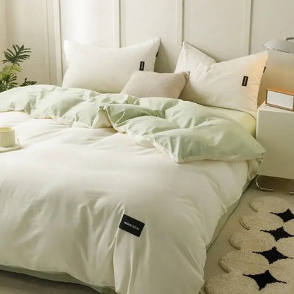 Soft cream cotton bedding set with soft mint green and white duvet featuring subtle texture and black brand tag decorbites cotton bedding