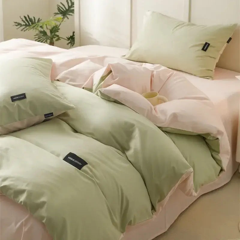 Pastel green and pink decorbites cotton bedding set with soft cream cotton fabric and subtle black brand tags