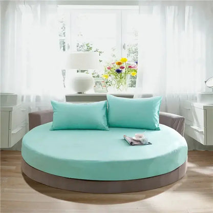 Circular cotton round bed with a soft mint green fabric cover and gray base from decorbites cotton round bed sheet set